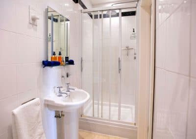 En-Suite bathroom with a walk-in shower off the bedroom overlooking the River Dart and Coronation Park.