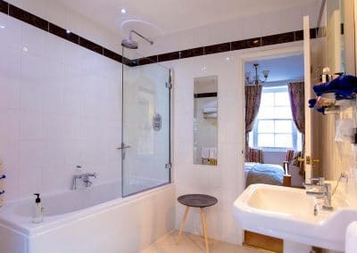 En-Suite bathroom with a shower looking out into the super-king bedroom overlooking Coronation Park.