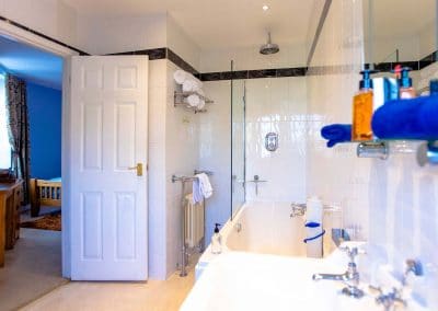 En-Suite bathroom with a shower looking out into the super-king bedroom overlooking the River Dart,