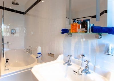 En-Suite bathroom with a shower and bathtub.